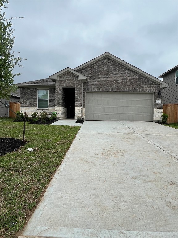 14330 Azalea Tree Drive Magnolia, TX 77354 - Photo 1 of 35 a front view of a house with a yard and garage