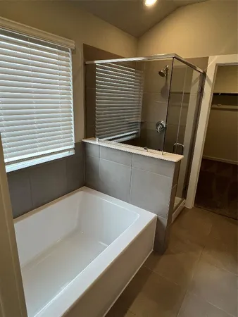 a bathroom with a double vanity sink and mirror