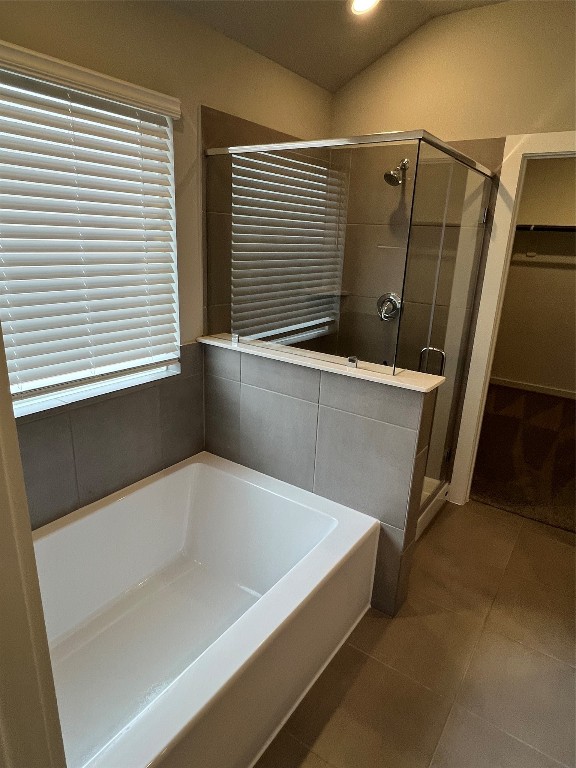14330 Azalea Tree Drive Magnolia, TX 77354 - Photo 21 of 35 a bathroom with a bathtub and a shower