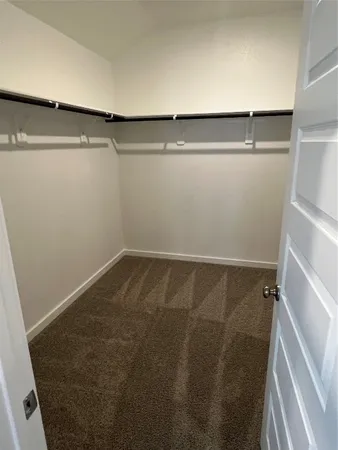 a bathroom with a bathtub and a window