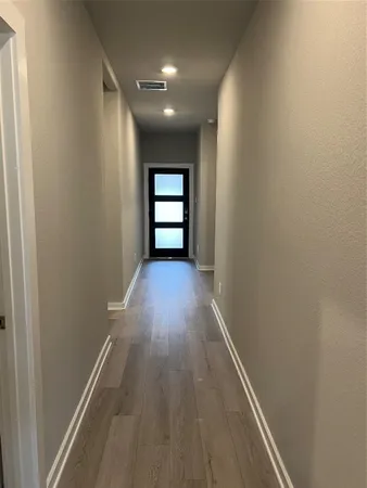 a view of gallery with wooden floor