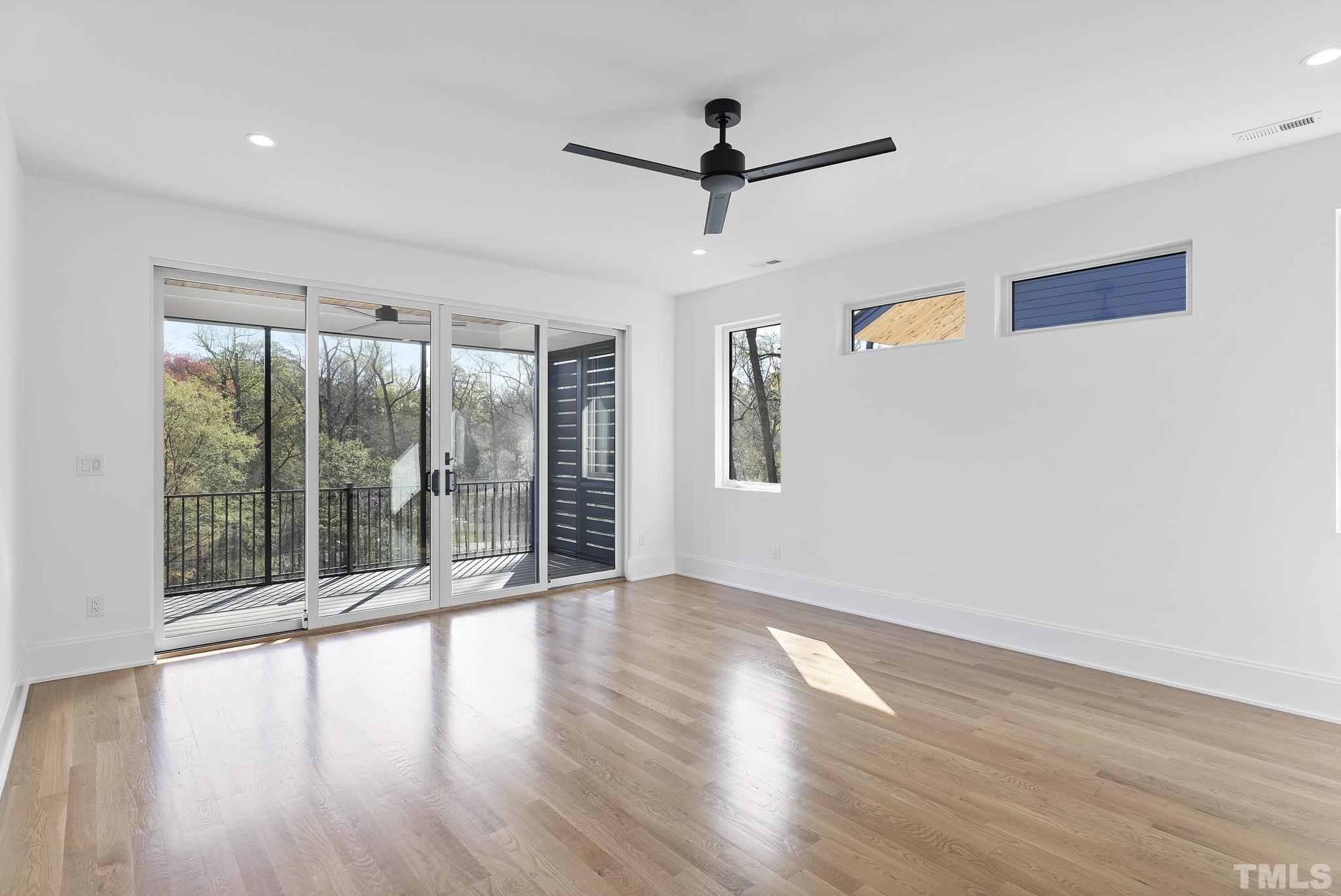 1621 Nottingham Road Raleigh, NC 27607 - Photo 20 of 49 a view of an empty room with wooden floor and a window