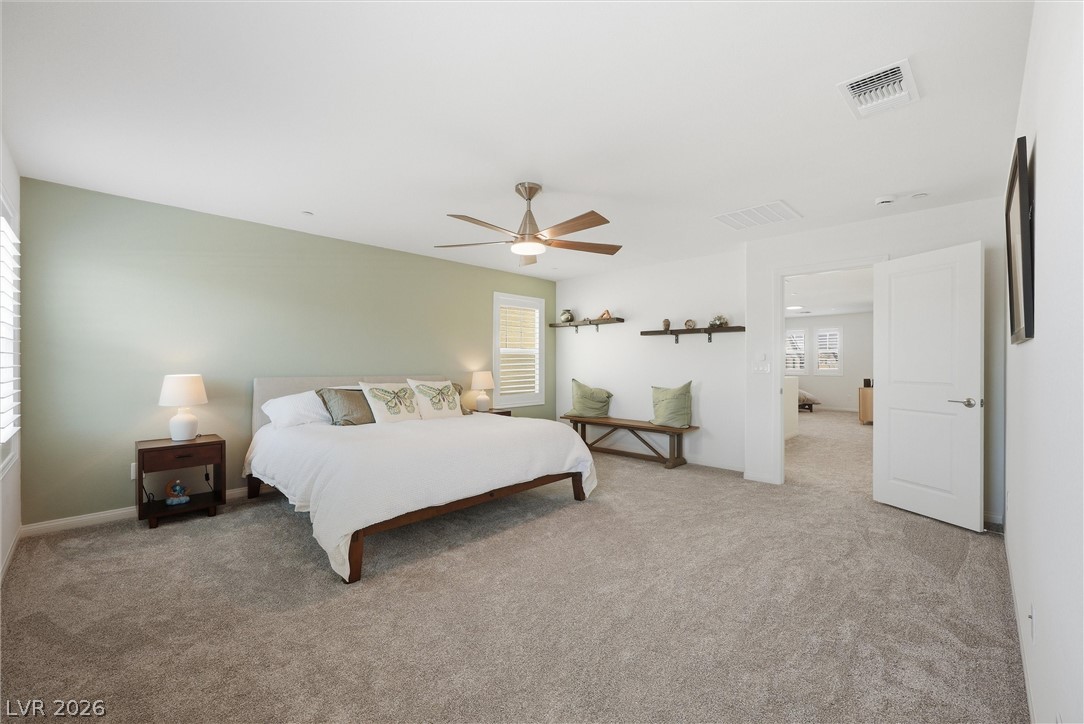 3705 Alla Rocca Avenue Henderson, NV 89044 - Photo 21 of 50 This tranquil bedroom features plush carpeting and a convenient ceiling fan for ultimate comfort.