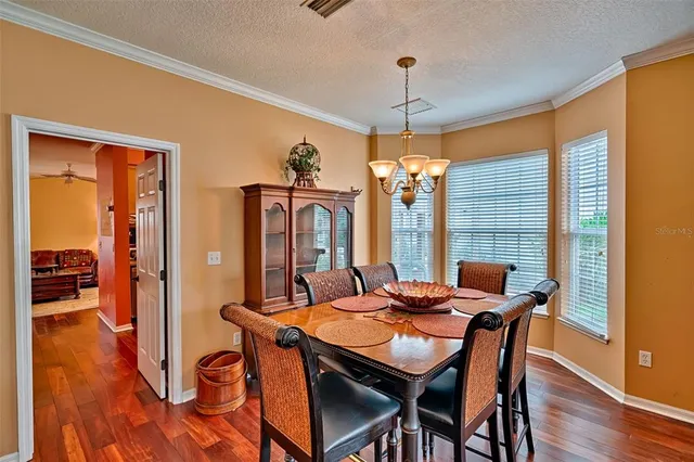 a bedroom with furniture and wooden floor