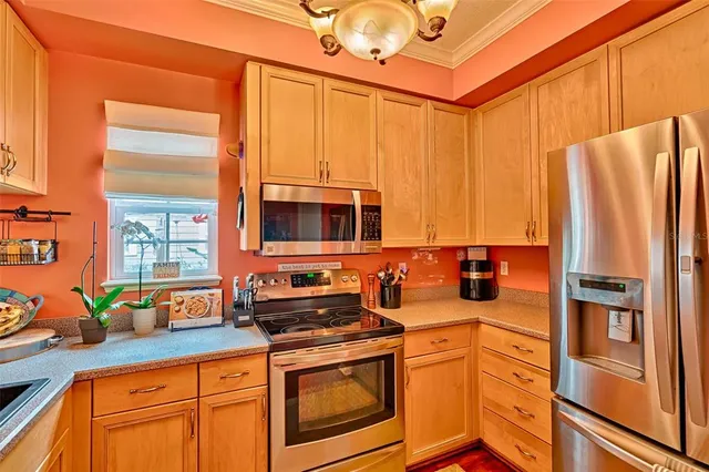 a living room with furniture a rug and a chandelier