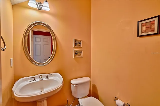 a view of an entryway with wooden floor and door