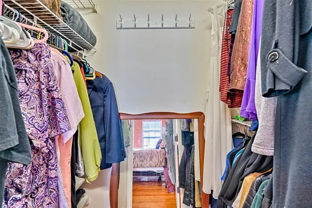 a view of a livingroom with furniture and a window