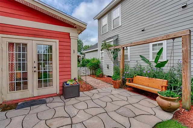 a view of a backyard with sitting area