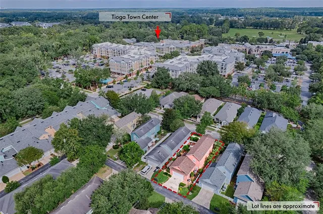 an aerial view of a house with a big yard