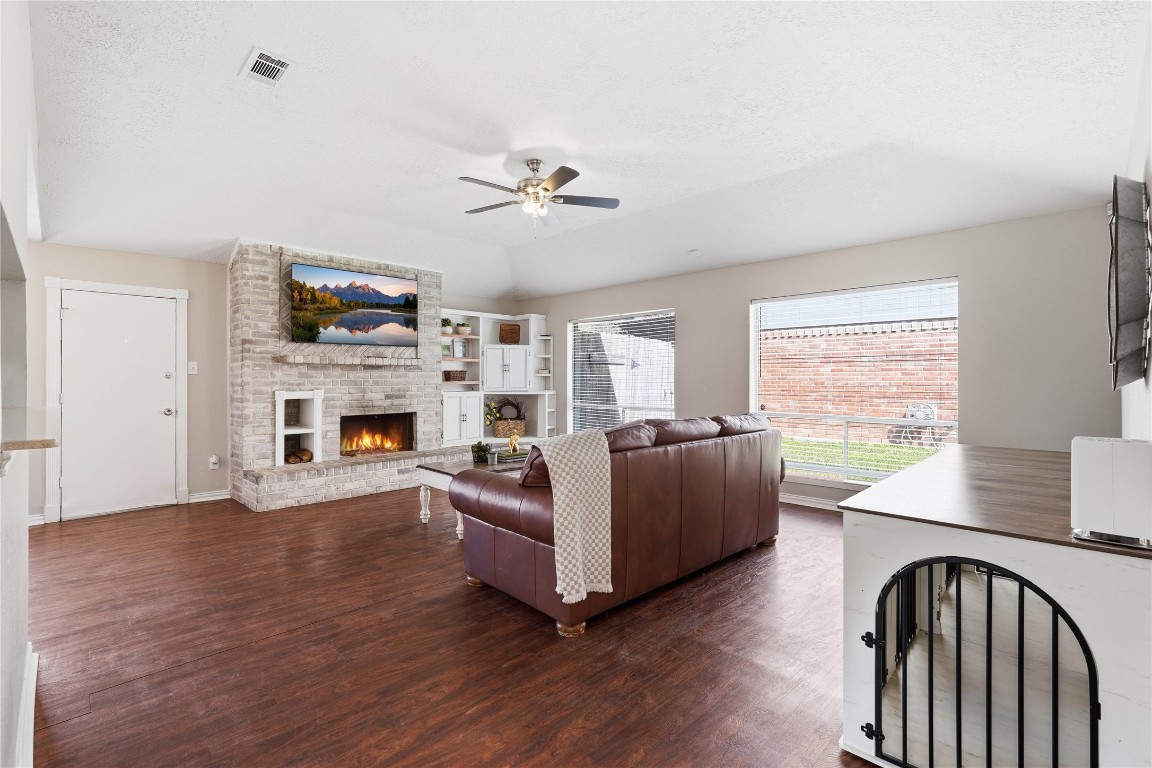 4506 Pineville Lane Spring, TX 77388 - Photo 12 of 36 Expansive living room with warm-toned floors, open to dining area.