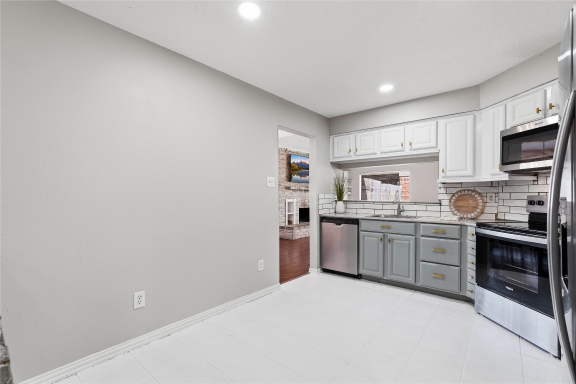 4506 Pineville Lane Spring, TX 77388 - Photo 16 of 36 a kitchen with cabinets and stainless steel appliances