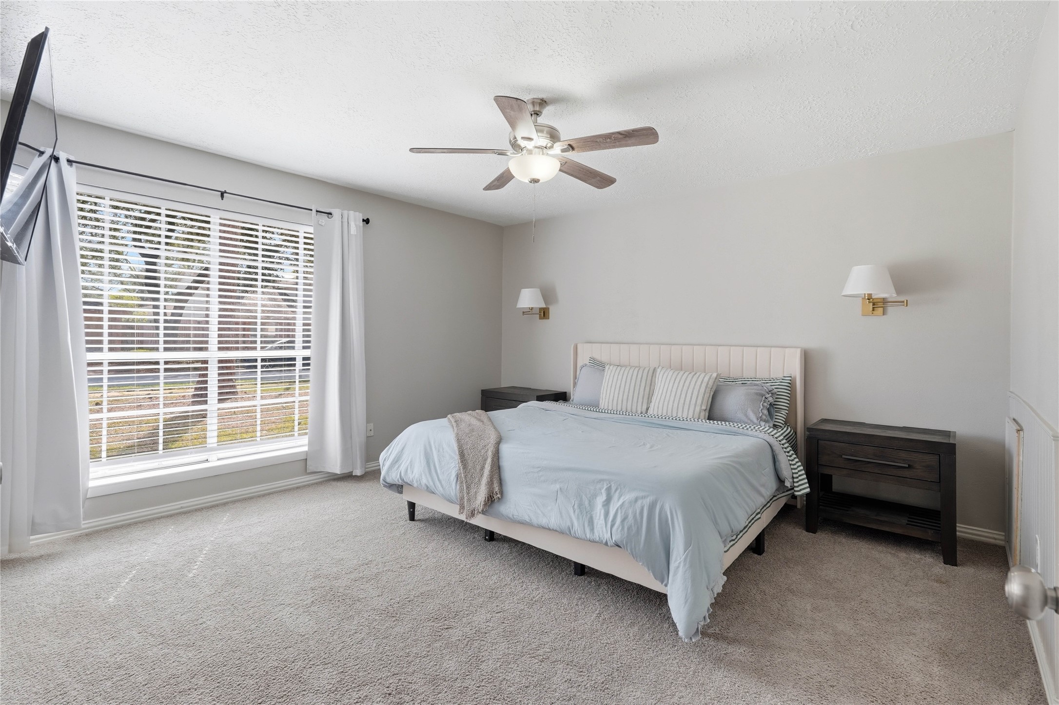 4506 Pineville Lane Spring, TX 77388 - Photo 22 of 36 Primary bedroom with plush carpeting, large windows and private ensuite bath