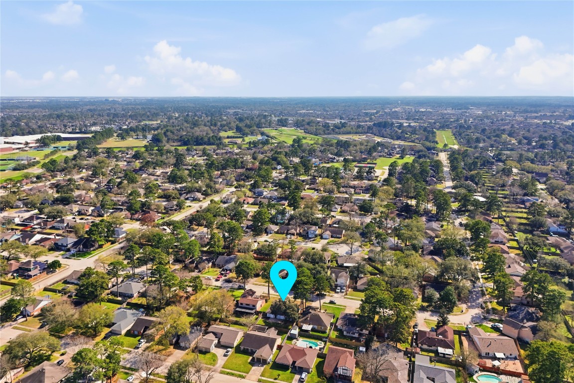 4506 Pineville Lane Spring, TX 77388 - Photo 33 of 36 an aerial view of a city with lots of residential buildings