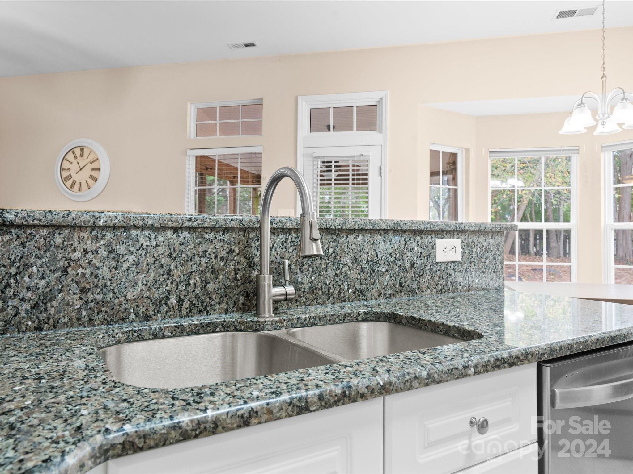 2010 Fairburn Court Fort Mill, SC 29708 - Photo 12 of 39 a kitchen with granite countertop a sink and a stove