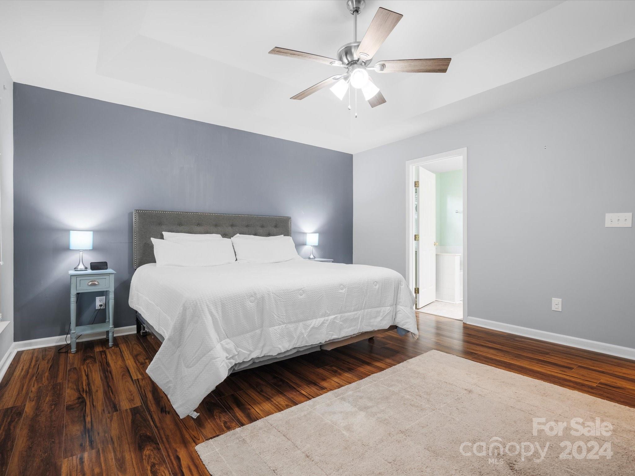 2010 Fairburn Court Fort Mill, SC 29708 - Photo 15 of 39 a bedroom with a large bed and a ceiling fan