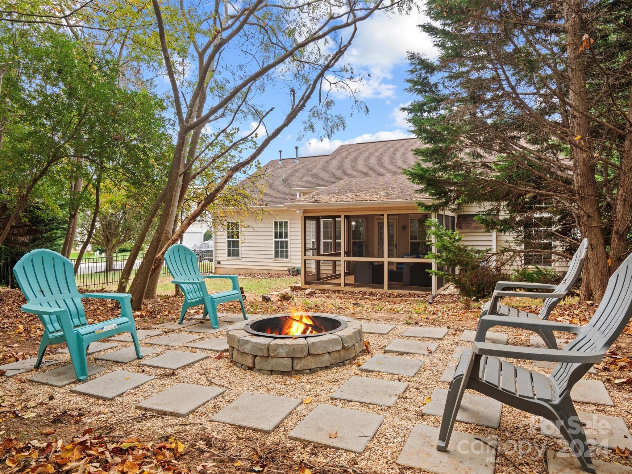 2010 Fairburn Court Fort Mill, SC 29708 - Photo 27 of 39 a view of a backyard with table and chairs and wooden fence