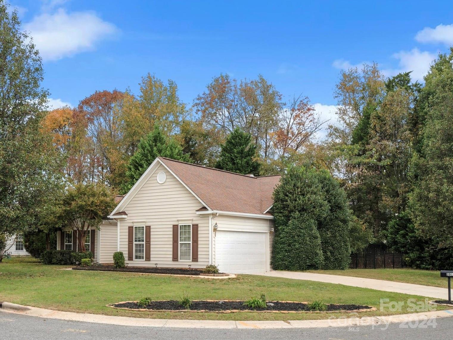 2010 Fairburn Court Fort Mill, SC 29708 - Photo 29 of 39 a view of a white house with a yard and large trees