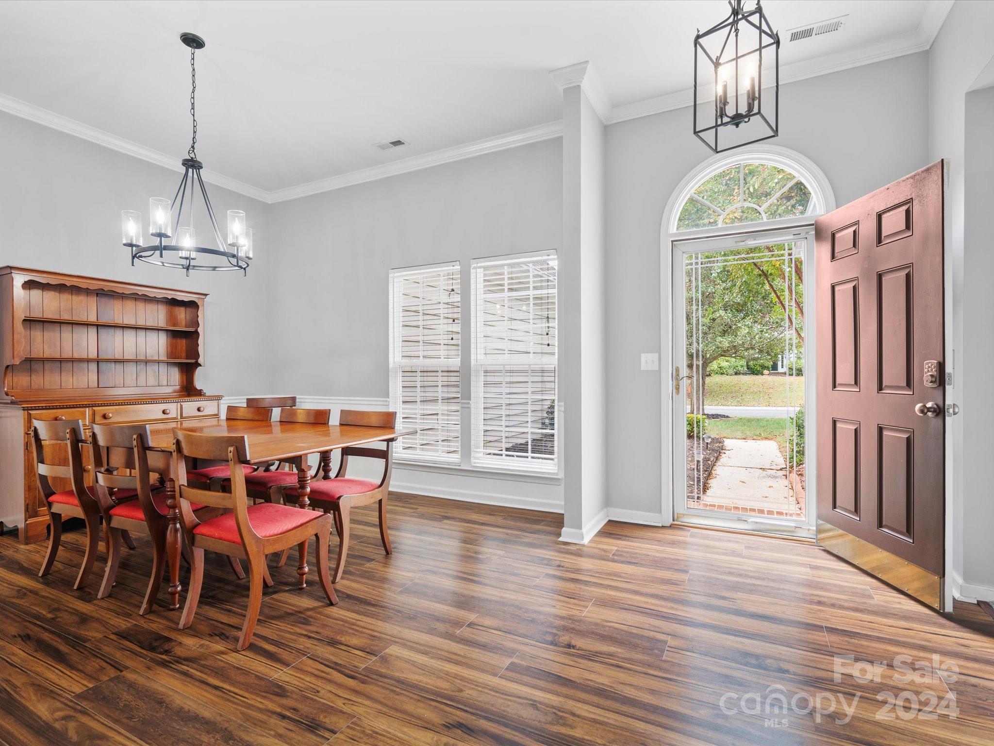 2010 Fairburn Court Fort Mill, SC 29708 - Photo 4 of 39 a view of a dining room with furniture window and wooden floor