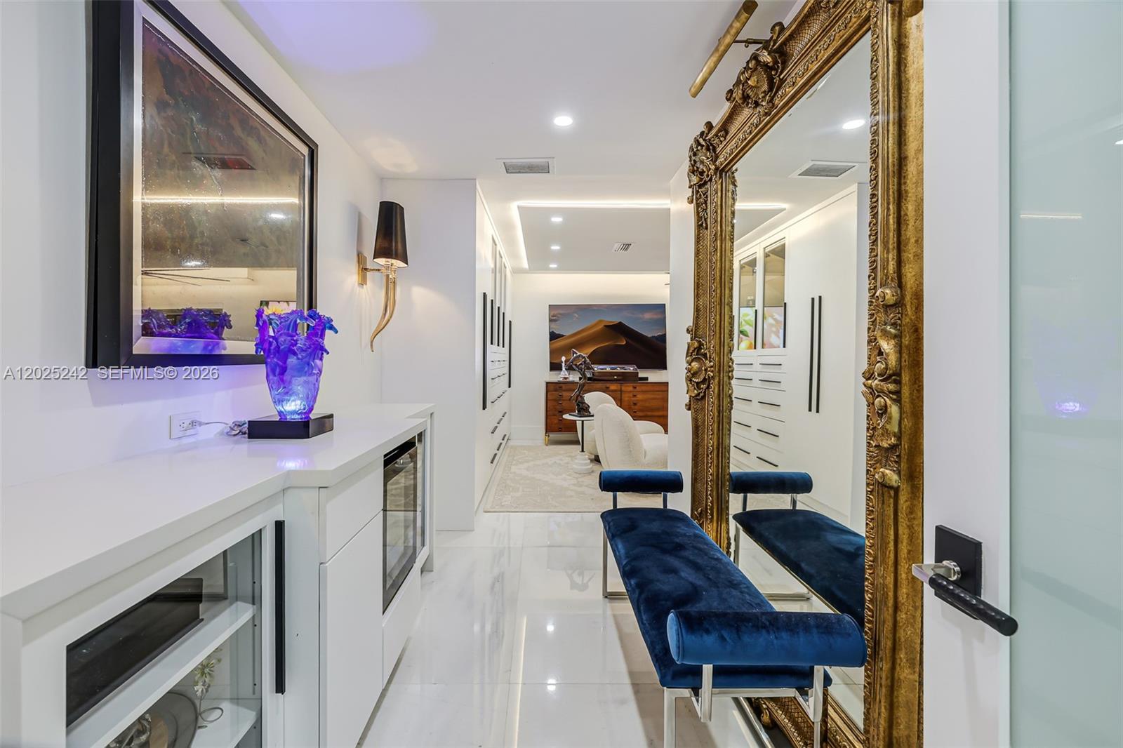 8761 Southwest 56th Street Miami, FL 33165 - Photo 44 of 90 a hallway with a view of living room with furniture and flat screen tv