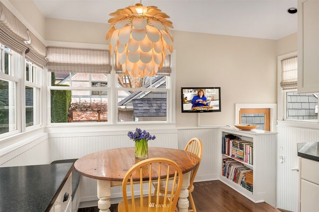 a bathroom with a sink a toilet and a window