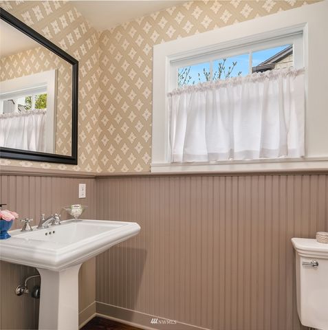 a view of a patio with table and chairs and potted plants
