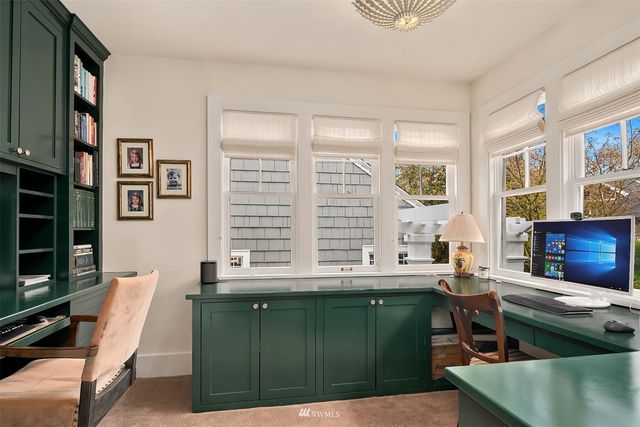 a view of a patio with table and chairs and potted plants