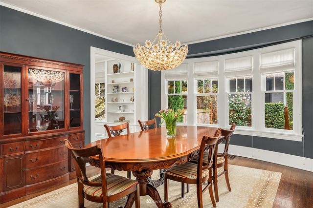 a very nice looking kitchen with granite countertop a stove and a sink