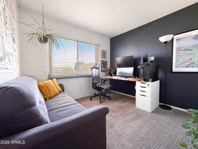 a bedroom with furniture and a window