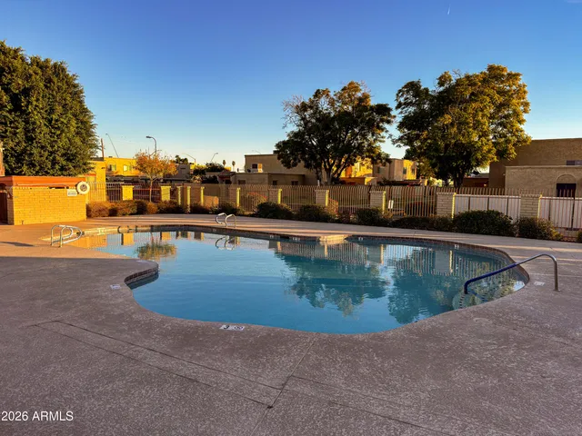 a view of a swimming pool with an outdoor space and seating area