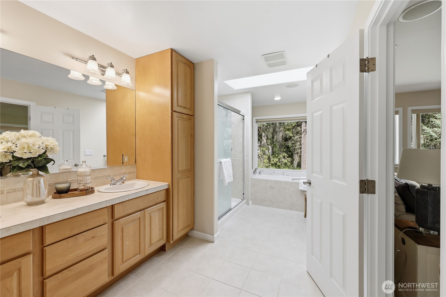 4354 Northwest Westgate Road Silverdale, WA 98383 - Photo 22 of 40 a bathroom with a tub sink and mirror