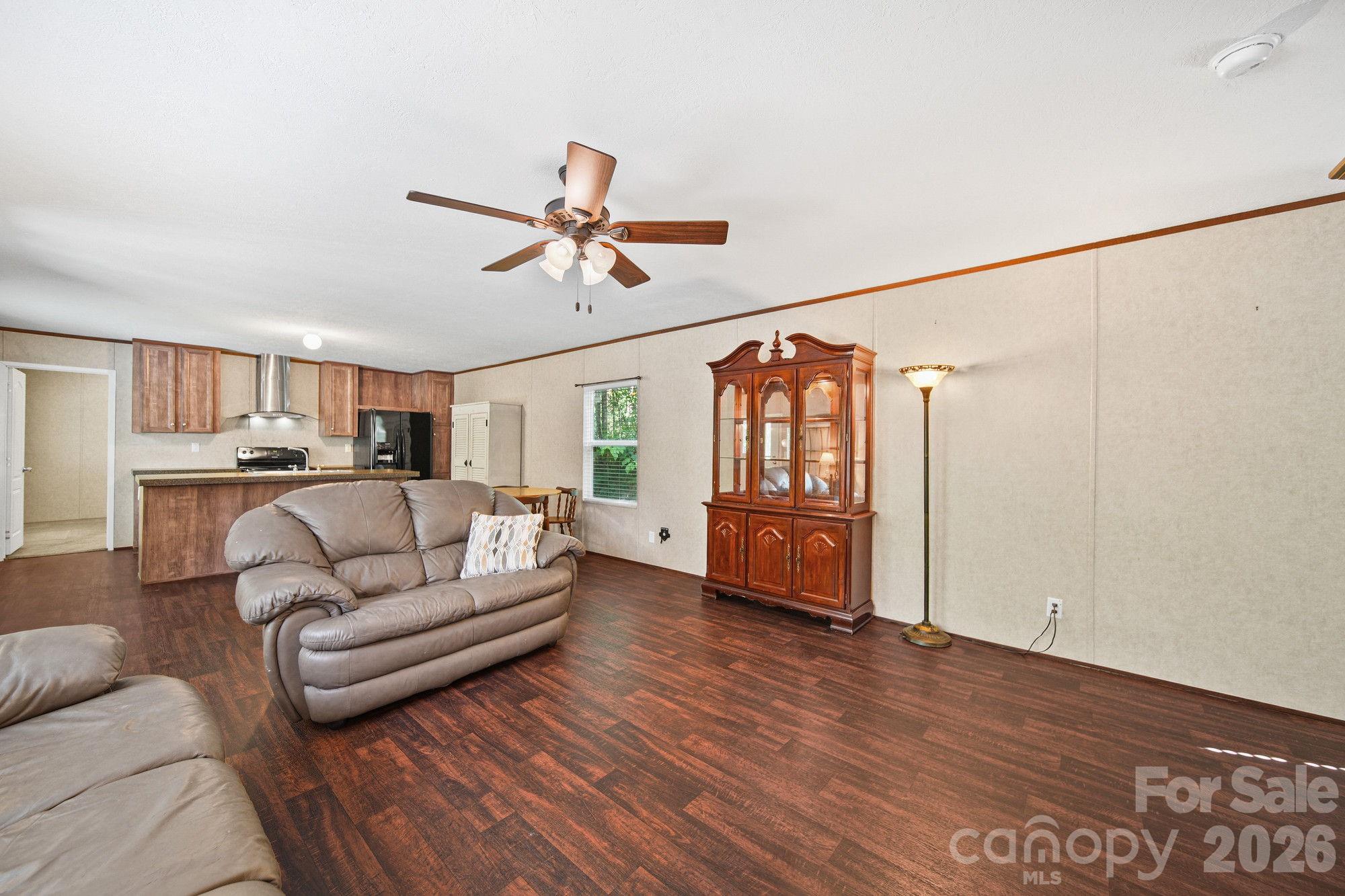 4507 White Store Road Wingate, NC 28174 - Photo 12 of 29 a living room with furniture and a wooden floor