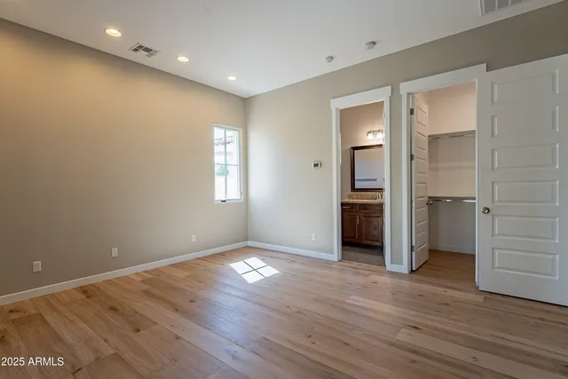 a large kitchen with stainless steel appliances granite countertop a stove and a refrigerator