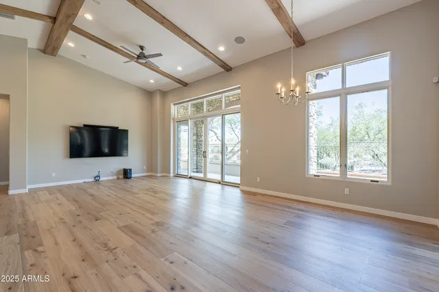 a kitchen with granite countertop a sink stove and refrigerator