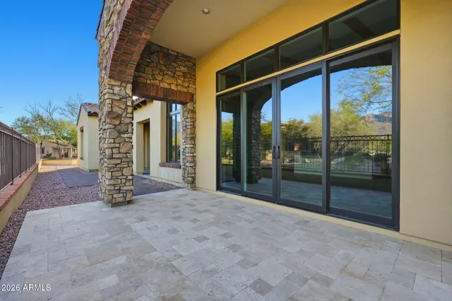an aerial view of a house with a garden and mountain view
