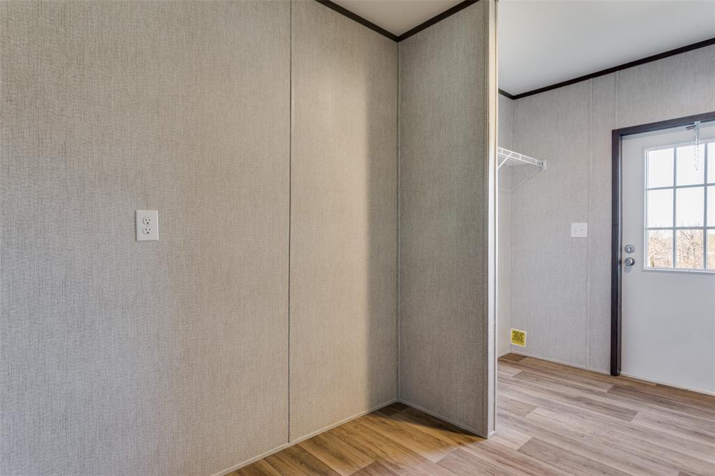 175 Cedar Drive Azle, TX 76020 - Photo 16 of 25 a view of an empty room with wooden floor