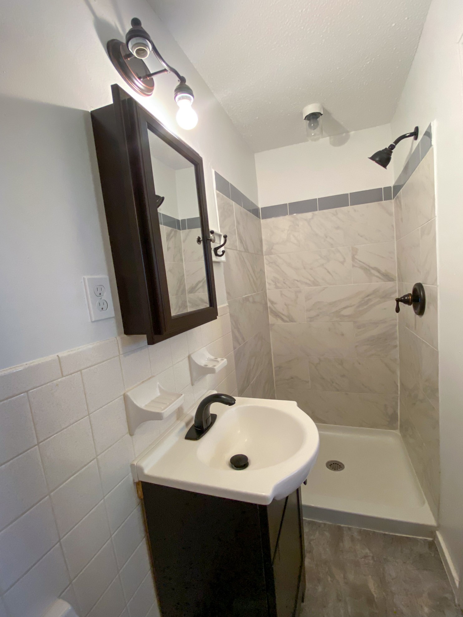 5366 Marion Road Cunningham, TN 37052 - Photo 13 of 29 a bathroom with a sink a mirror and a shower