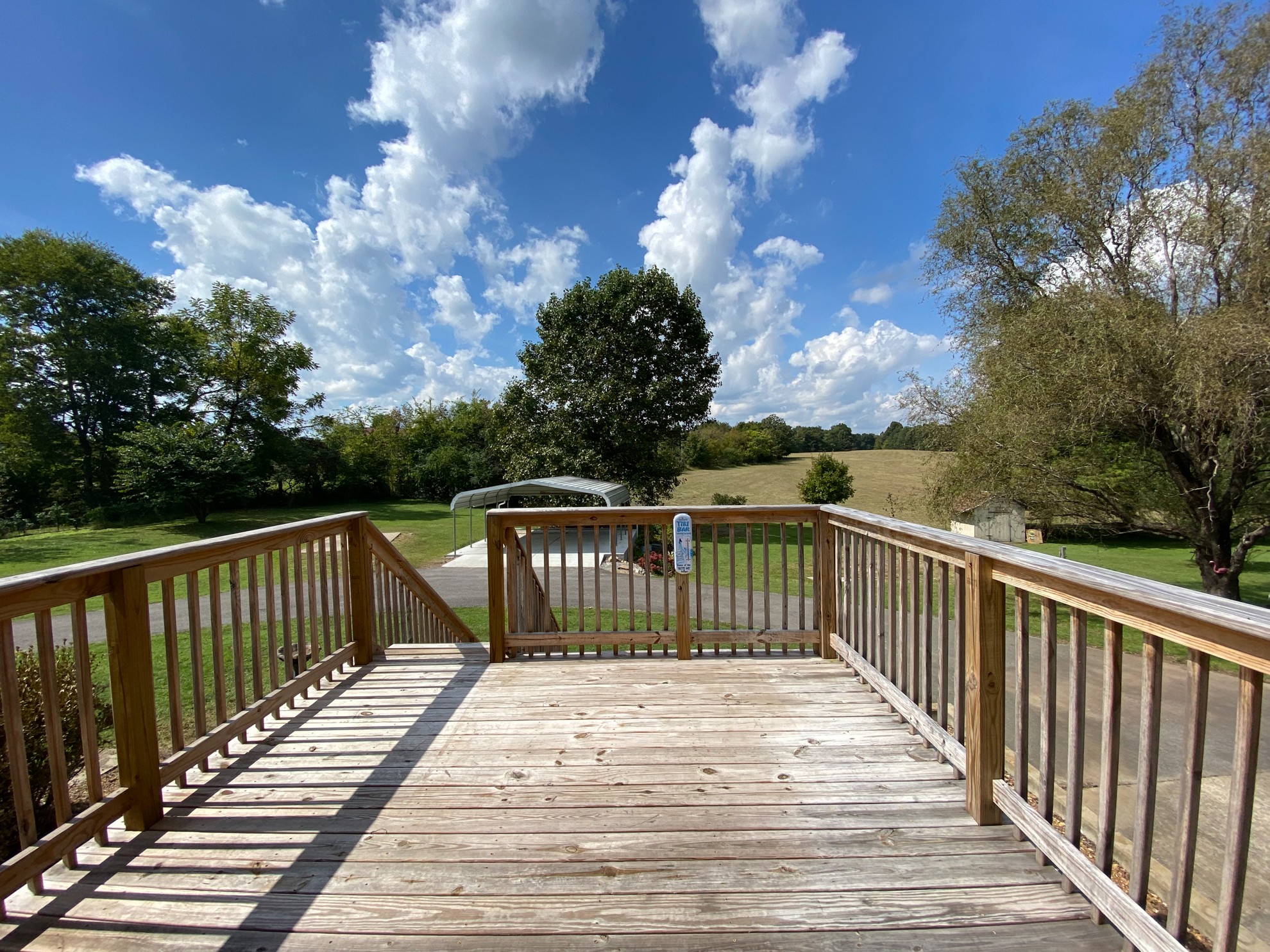 5366 Marion Road Cunningham, TN 37052 - Photo 20 of 29 a view of a deck with wooden floor and fence