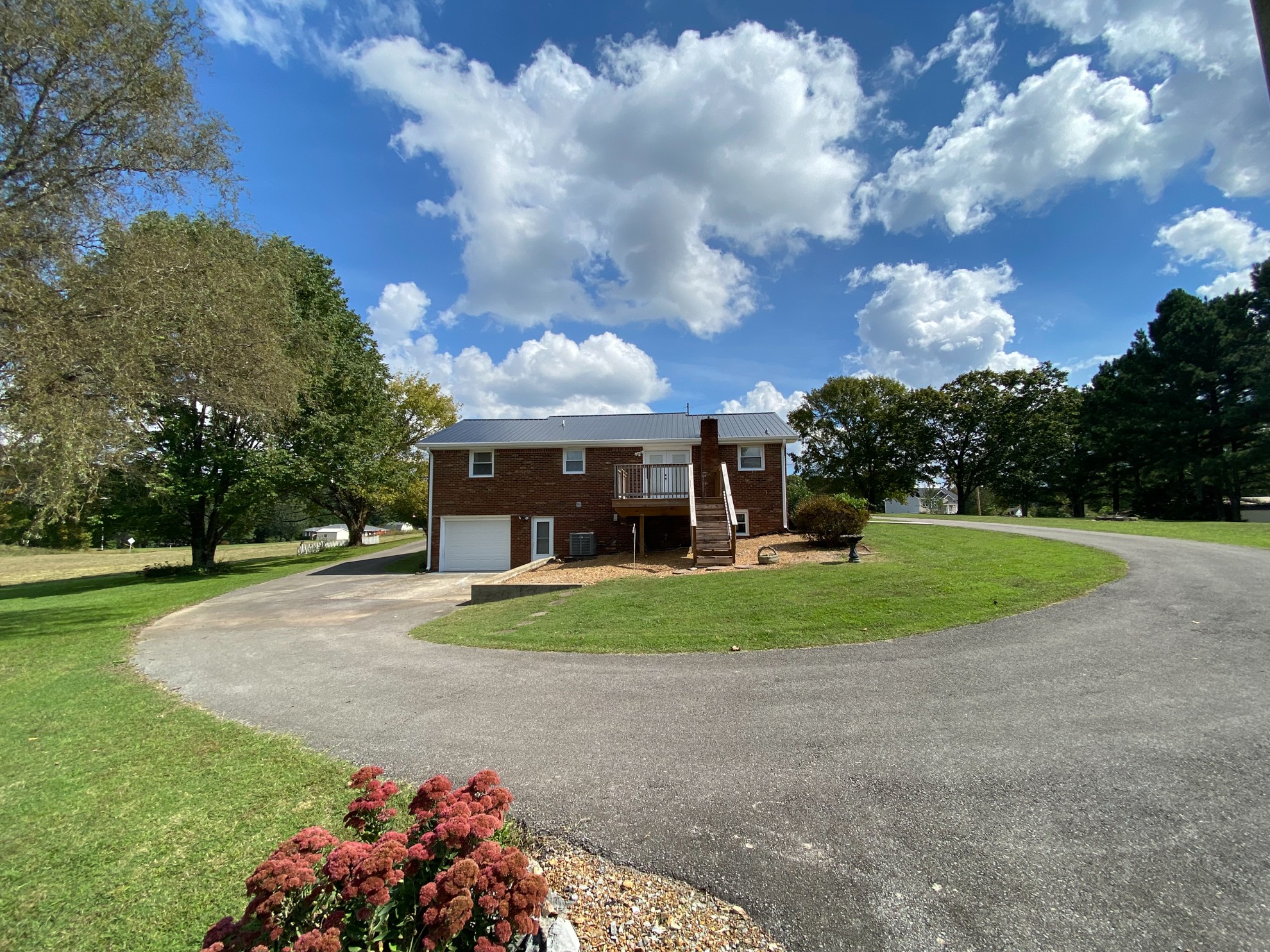 5366 Marion Road Cunningham, TN 37052 - Photo 25 of 29 a front view of a house with a yard and garage