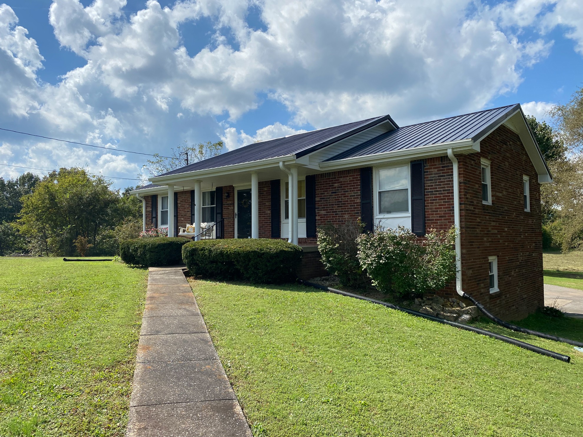 5366 Marion Road Cunningham, TN 37052 - Photo 4 of 29 a front view of a house with garden