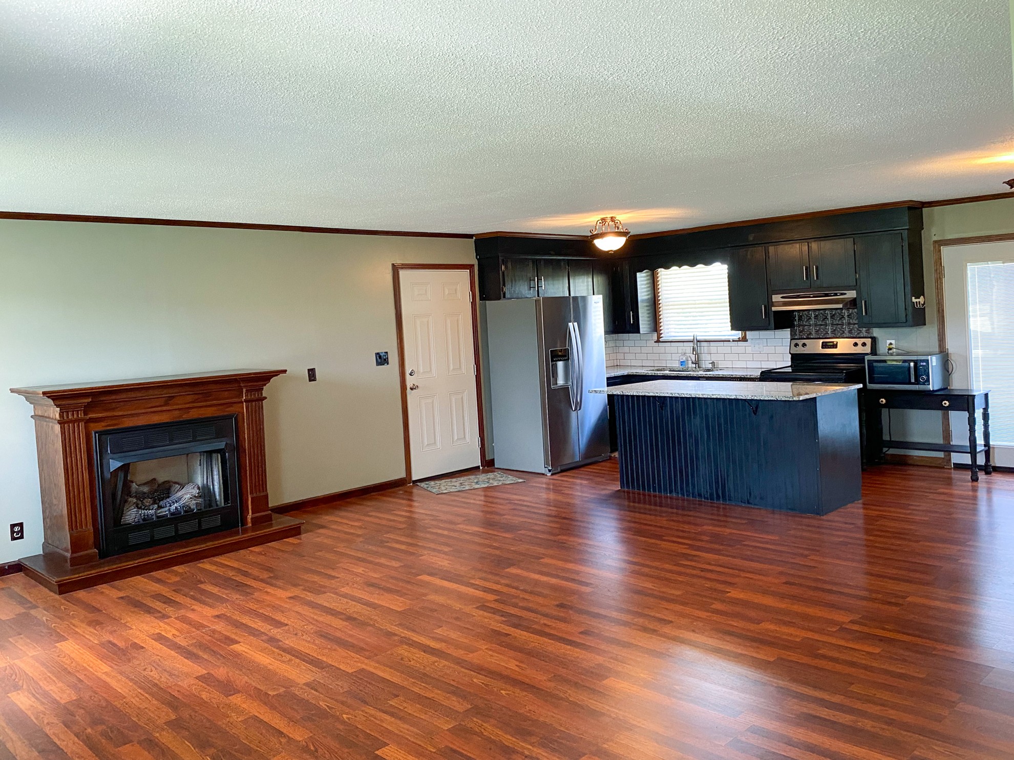5366 Marion Road Cunningham, TN 37052 - Photo 5 of 29 a view of kitchen with cabinets and wooden floor