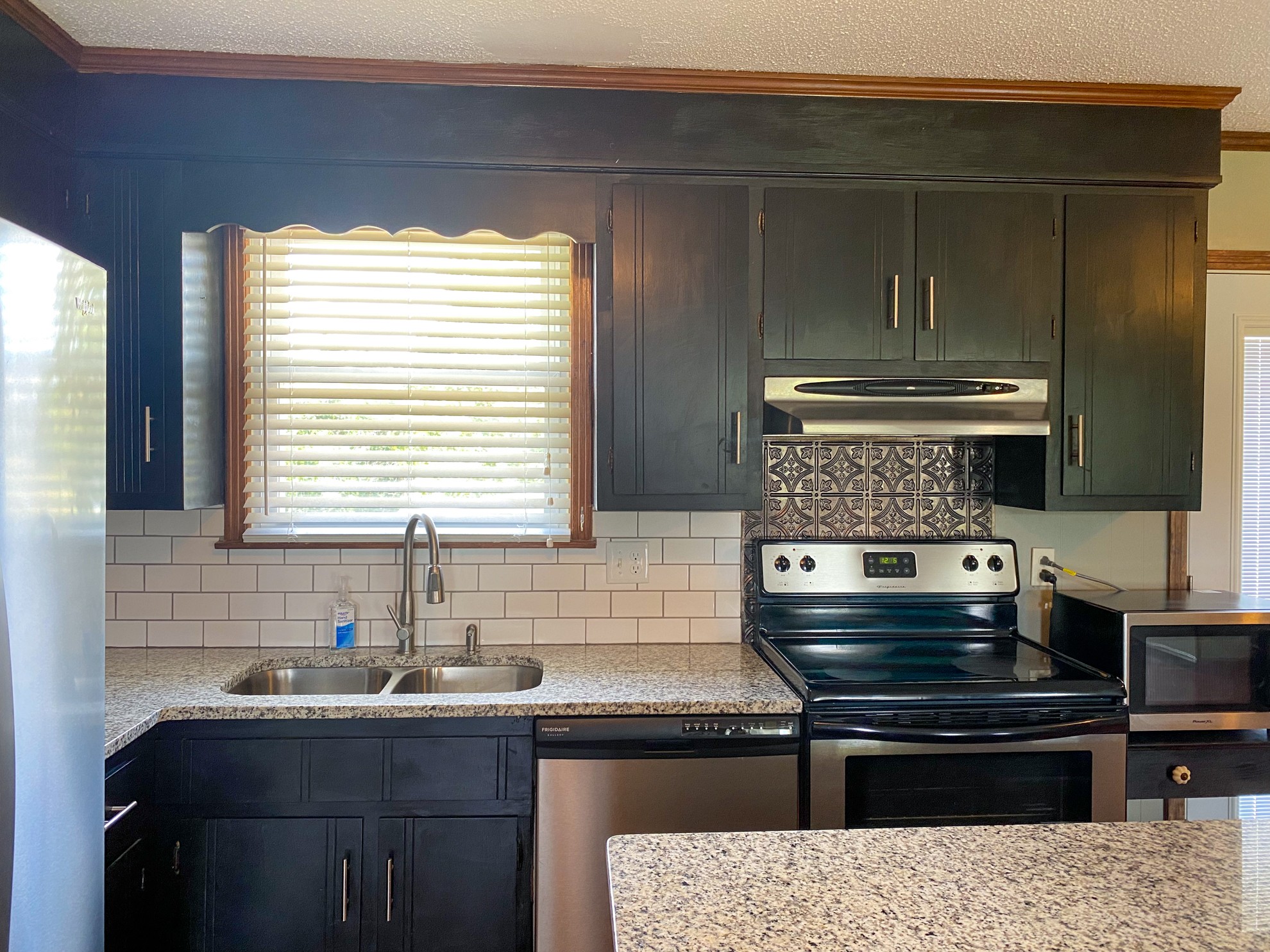 5366 Marion Road Cunningham, TN 37052 - Photo 8 of 29 a kitchen with a sink and wooden cabinets