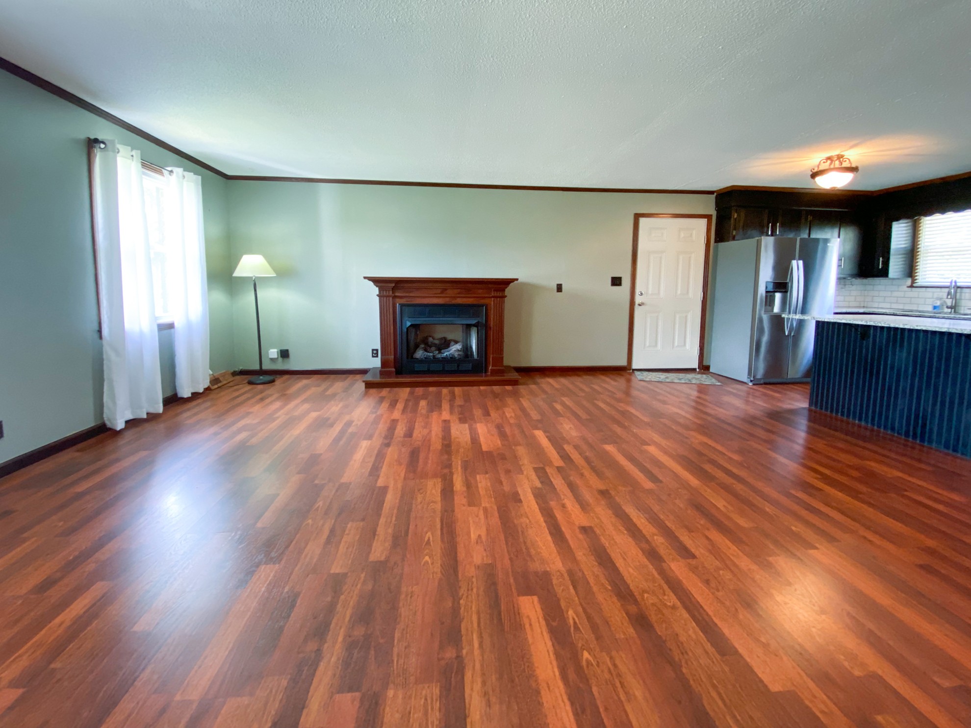 5366 Marion Road Cunningham, TN 37052 - Photo 9 of 29 a view of a livingroom with wooden floor and a fireplace