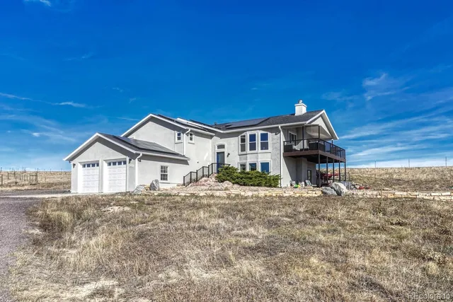 a kitchen with kitchen island granite countertop a sink stove and refrigerator