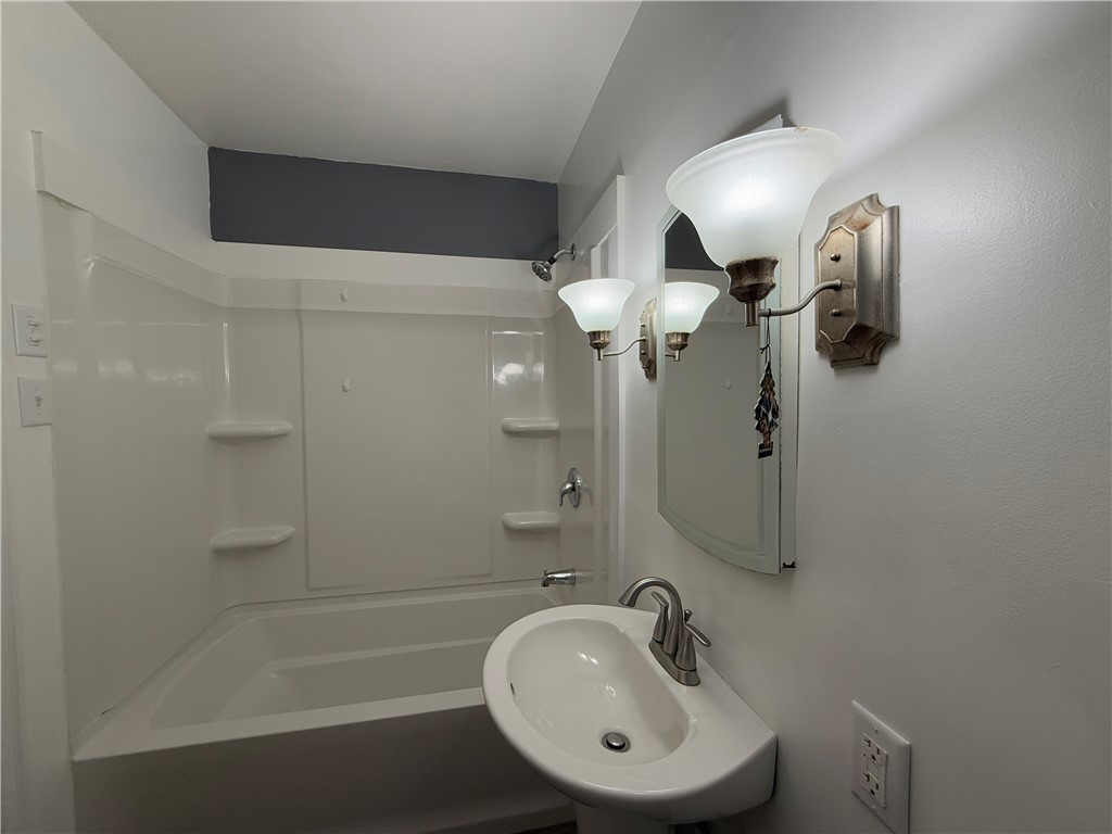 955 North McClellan Street Decatur, IL 62522 - Photo 14 of 17 a bathroom with a sink a toilet and shower