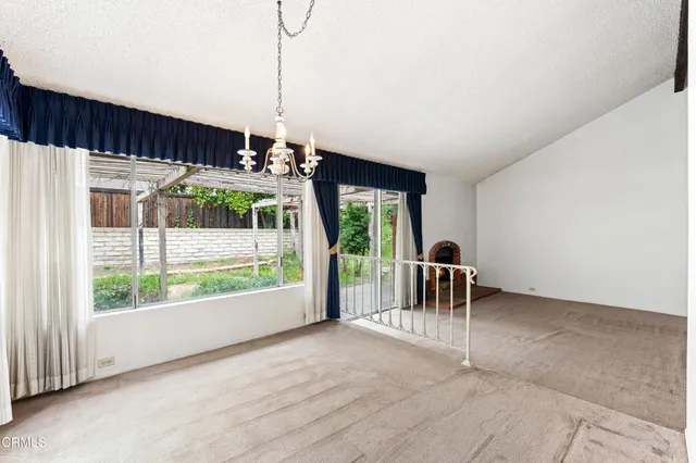 a view of a furniture and floor to ceiling window