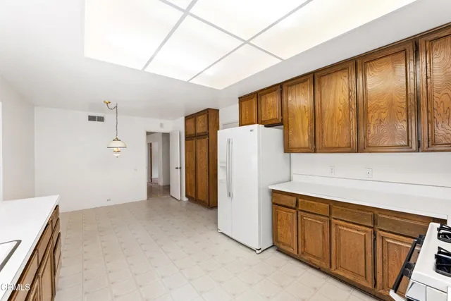a view of a room with wooden floor and windows