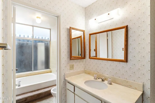 an empty room with large windows