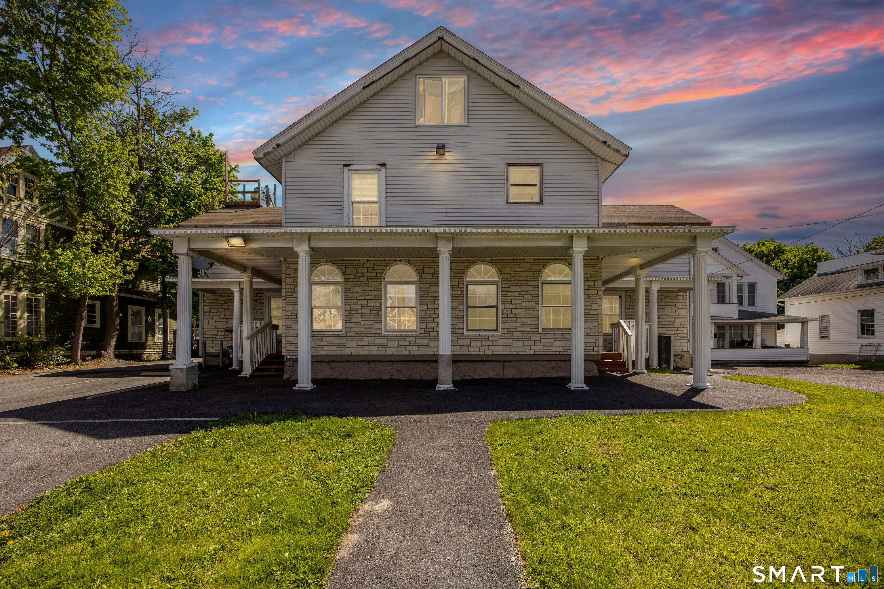277 South Main Street Torrington, CT 06790 - Photo 1 of 26 a front view of a house with a yard
