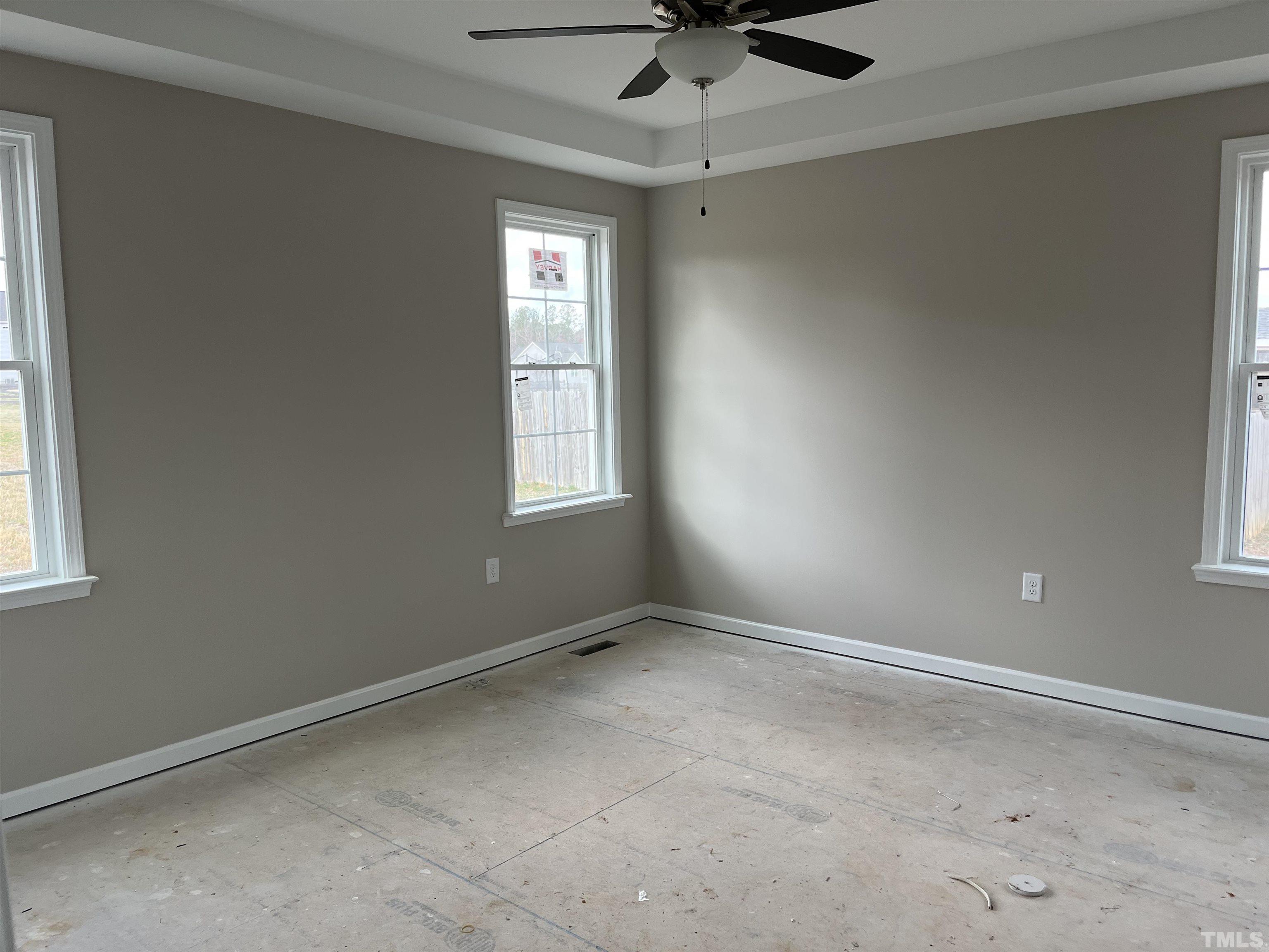 11016 Selma Road Middlesex, NC 27557 - Photo 13 of 22 an empty room with a window and a fan