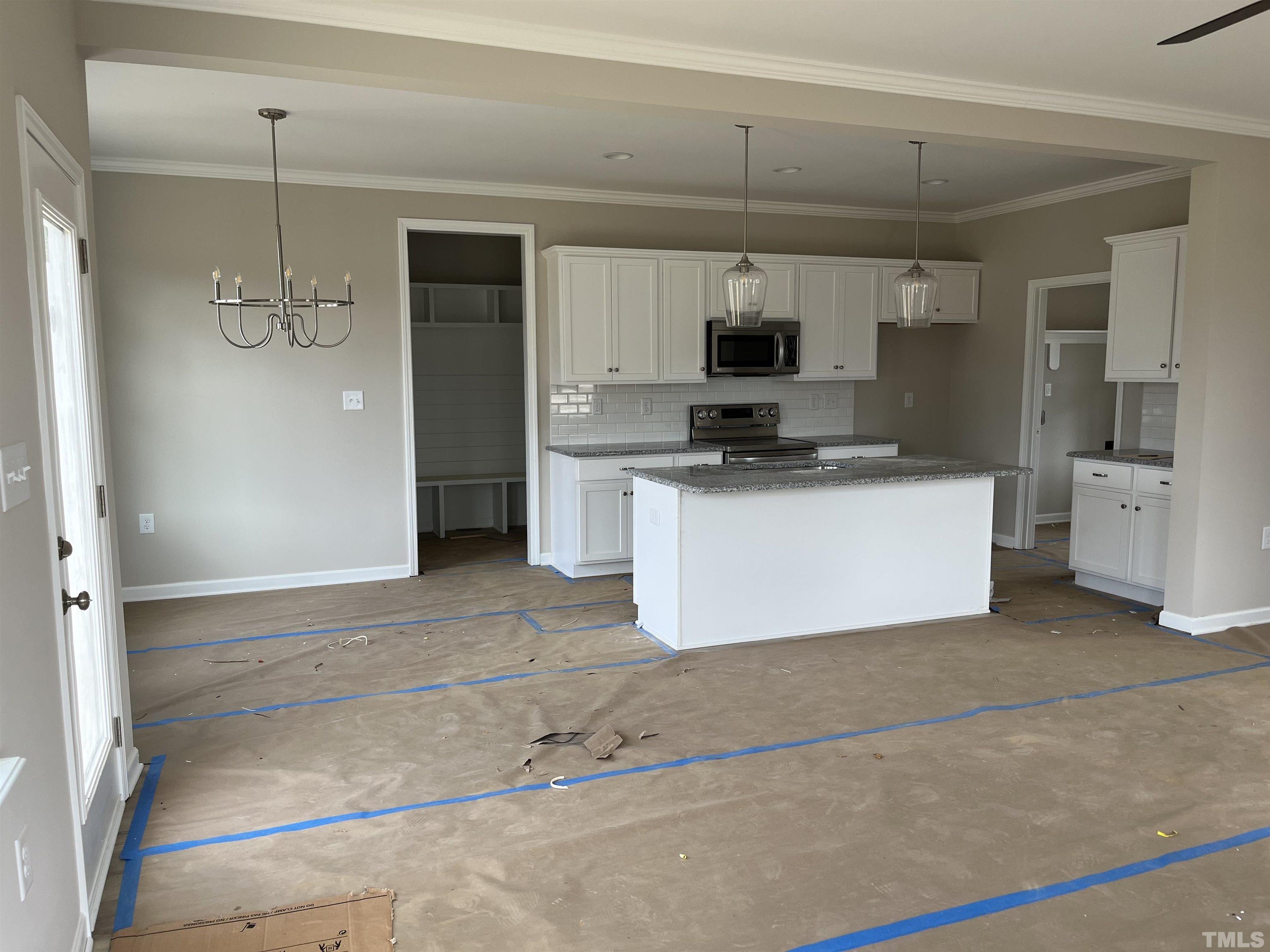 11016 Selma Road Middlesex, NC 27557 - Photo 5 of 22 a kitchen with stainless steel appliances a stove a refrigerator and a sink